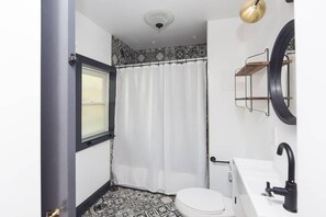 Bathtub, hair dryer, towels