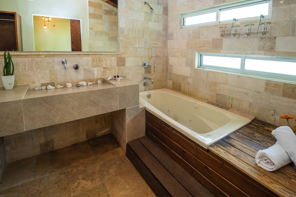 junior suite | bathroom | shower, towels, soap, shampoo