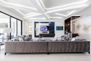 House, Multiple Beds (W318: 9 Bed, Avengers, Aladdin, Super) | Living room | Flat-screen TV, fireplace, table football, ping pong - W318: 9 Bed, Avengers, Aladdin, Superhero Arcade (Kissimmee)