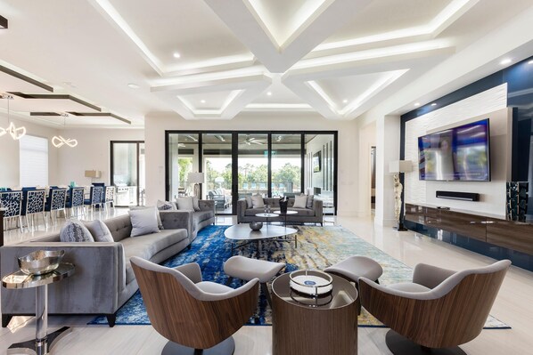 House, Multiple Beds (W318: 9 Bed, Avengers, Aladdin, Super) | Living room | Flat-screen TV, fireplace, table football, ping pong - W318: 9 Bed, Avengers, Aladdin, Superhero Arcade (Kissimmee)