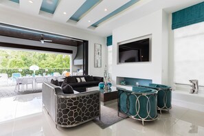 House, Multiple Beds (W003: 6 Bed, Princess, Minions, Star ) | Living room | Flat-screen TV, foosball - W003: 6 Bed, Princess, Minions, Star Wars Arcade by Villatel (Kissimmee)