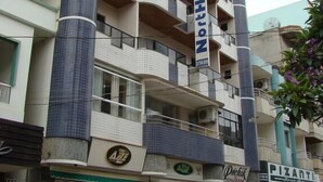 A multi-story hotel with balconies, a visible restaurant sign, and parked cars. - NortHotel (Barra De Sao Francisco)