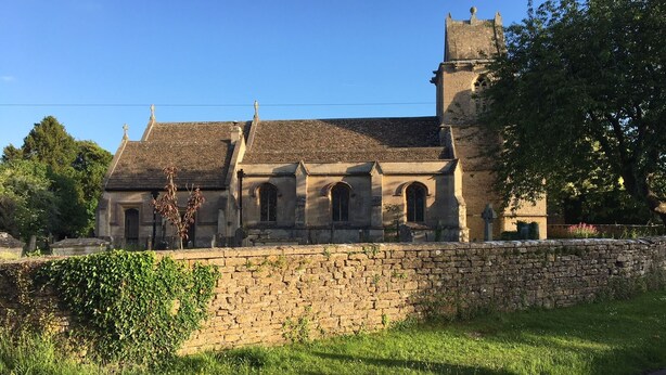 A historic stone church with a prominent tower and arched windows. - A stylish Barn conversion with the perfect mix of industrial and country styling (Bradford-on-Avon)
