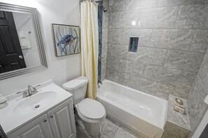 Combined shower/tub, hair dryer, towels, soap