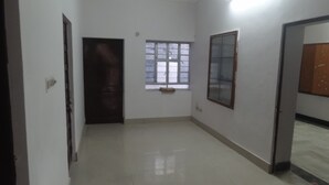 A room with a door, a window, and a wall-mounted light fixture. - Room in a Villa 3km from City Center, 1km from IT park (Udaipur)