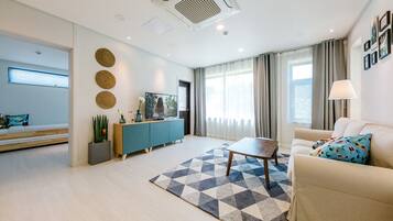 Family Villa, 2 Bedrooms (301) | Living room | 55-inch LED TV with cable channels, TV, heated floors