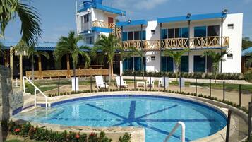 Outdoor pool, open 6:00 AM to 11:00 PM, pool umbrellas