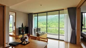 Premier Apartment, 2 Bedrooms | Living area | Flat-screen TV