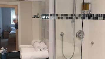 Combined shower/bathtub, hair dryer, towels