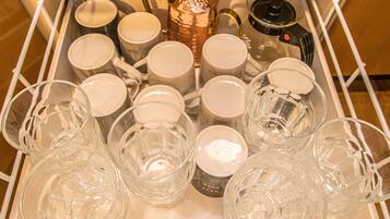 A tray with various glassware and a decorative item.