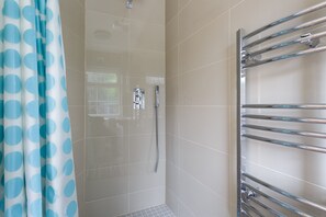 Shower, towels, soap, toilet paper