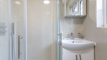 Shower, towels, soap, toilet paper