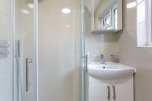 Shower, towels, soap, toilet paper
