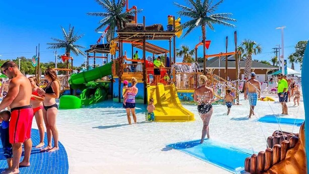 A water park with slides and play structures. - Fantastic location!!  Short walk to BEACH, Pools, and WATER PARK!  (Myrtle Beach)