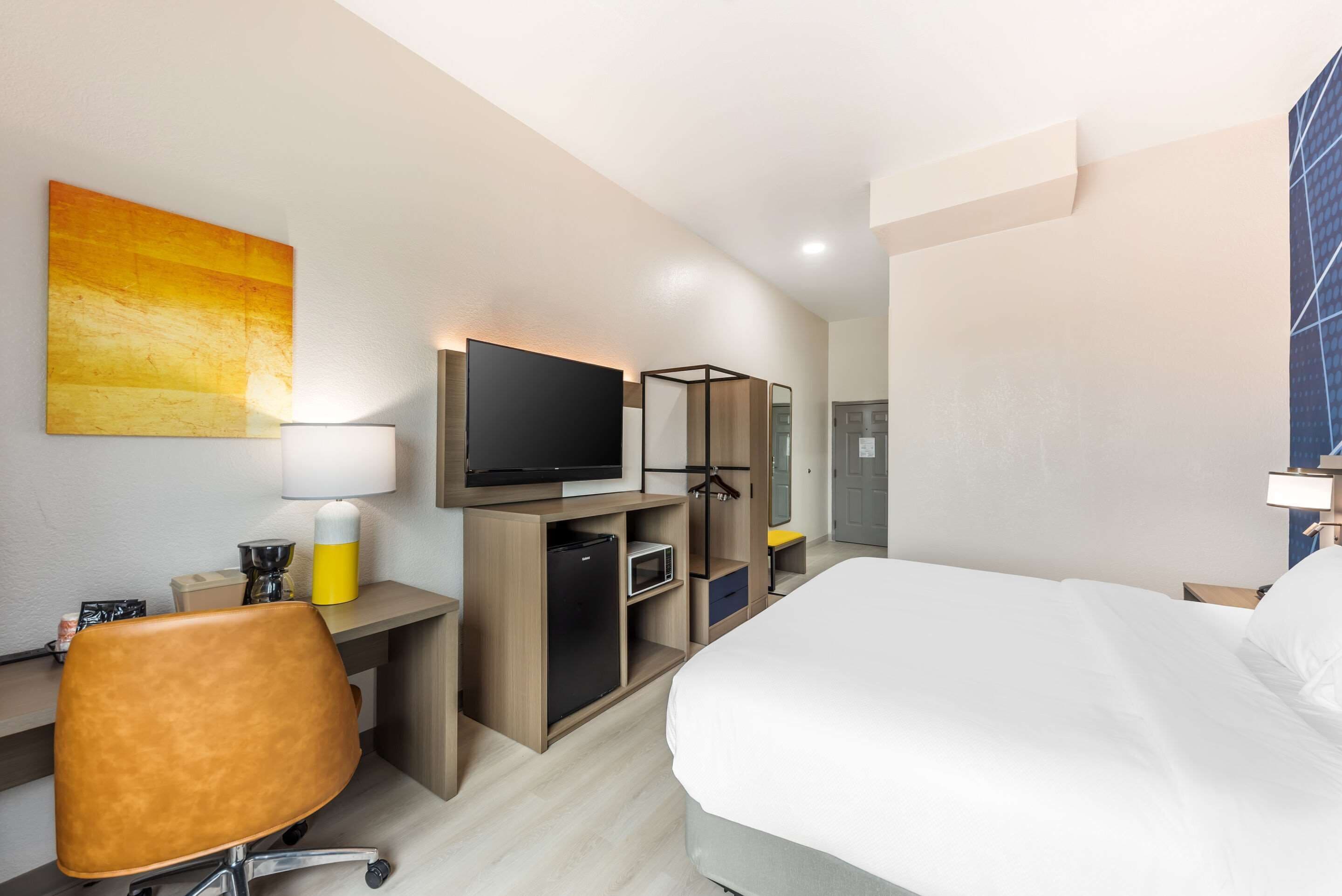 desk, laptop workspace, blackout curtains, iron/ironing board