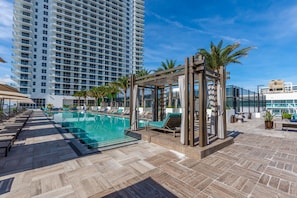 A rooftop pool area with lounge chairs and a pergola. - Hollywood Beach HHouse Rentals (Hollywood)
