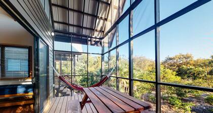 Romantic cabana with veranda, hammock, partial AC & WiFi - walk to the beach
