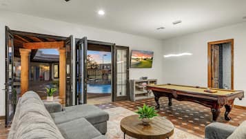 Flat-screen TV, fireplace, foosball, table tennis
