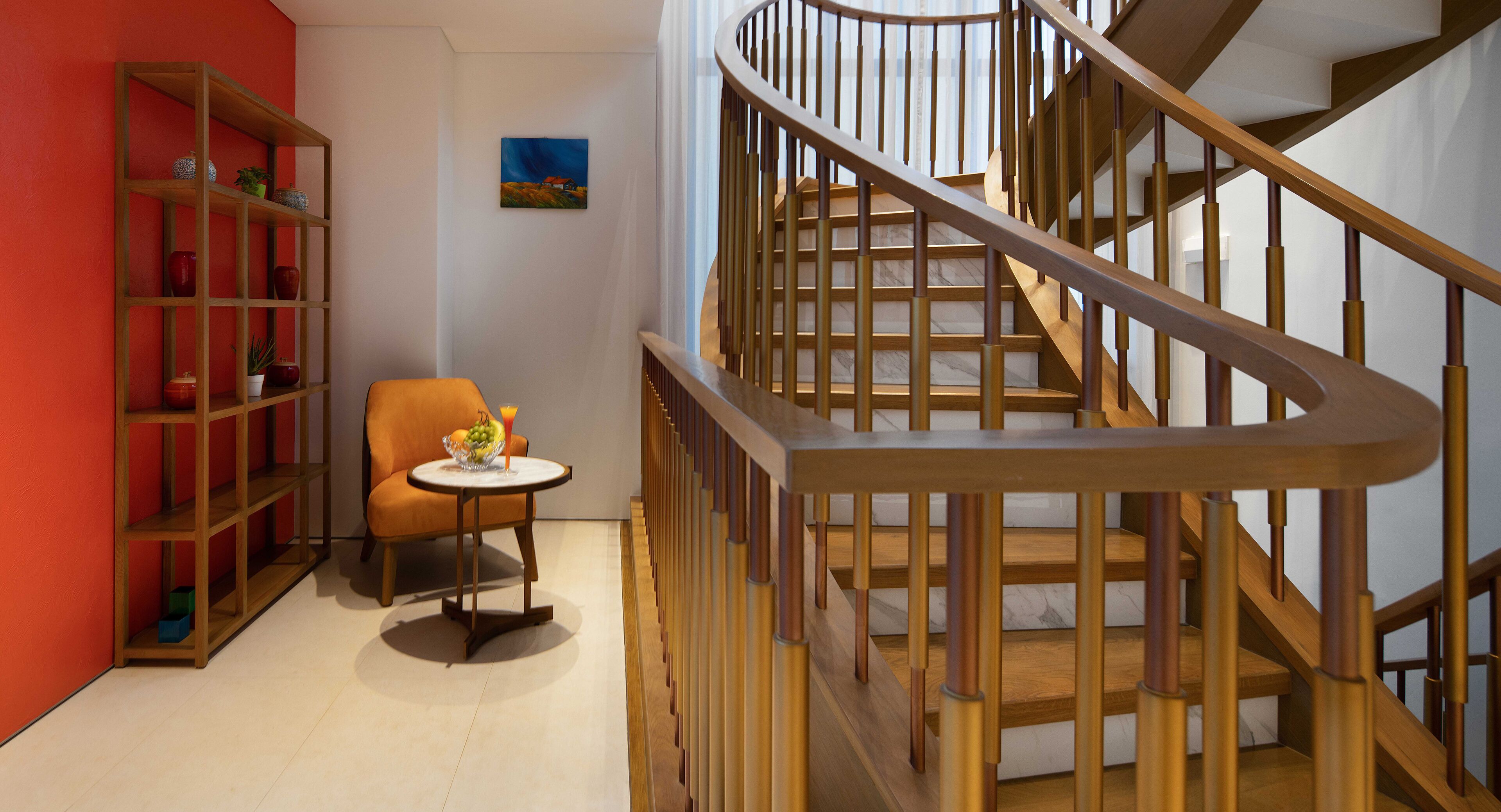 A staircase with wooden railings and a chair with a table beside it.