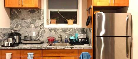 Microwave, dishwasher, coffee/tea maker, cookware/dishes/utensils