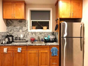 Microwave, dishwasher, coffee/tea maker, cookware/dishes/utensils