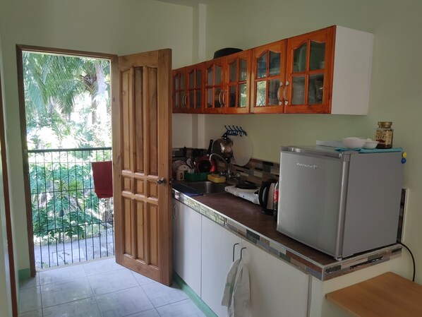Fridge, electric kettle, cookware/dishes/utensils