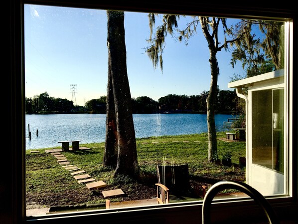 Enjoy a serene lakeside view from the comfort of your room, with a wooden deck and gazebo offering a peaceful retreat.