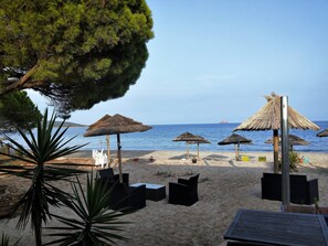 On the beach, sun loungers