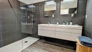 Shower, hair dryer, towels, shampoo