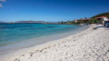 On the beach, sun loungers, beach towels