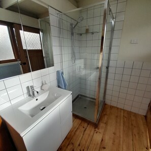 Shower, towels, soap, toilet paper
