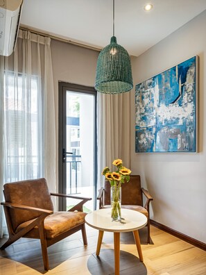 Deluxe Apartment | Living area | 32-inch flat-screen TV with digital channels, TV, Netflix - The Art - Sunshine Apartment (Ho Chi Minh City)