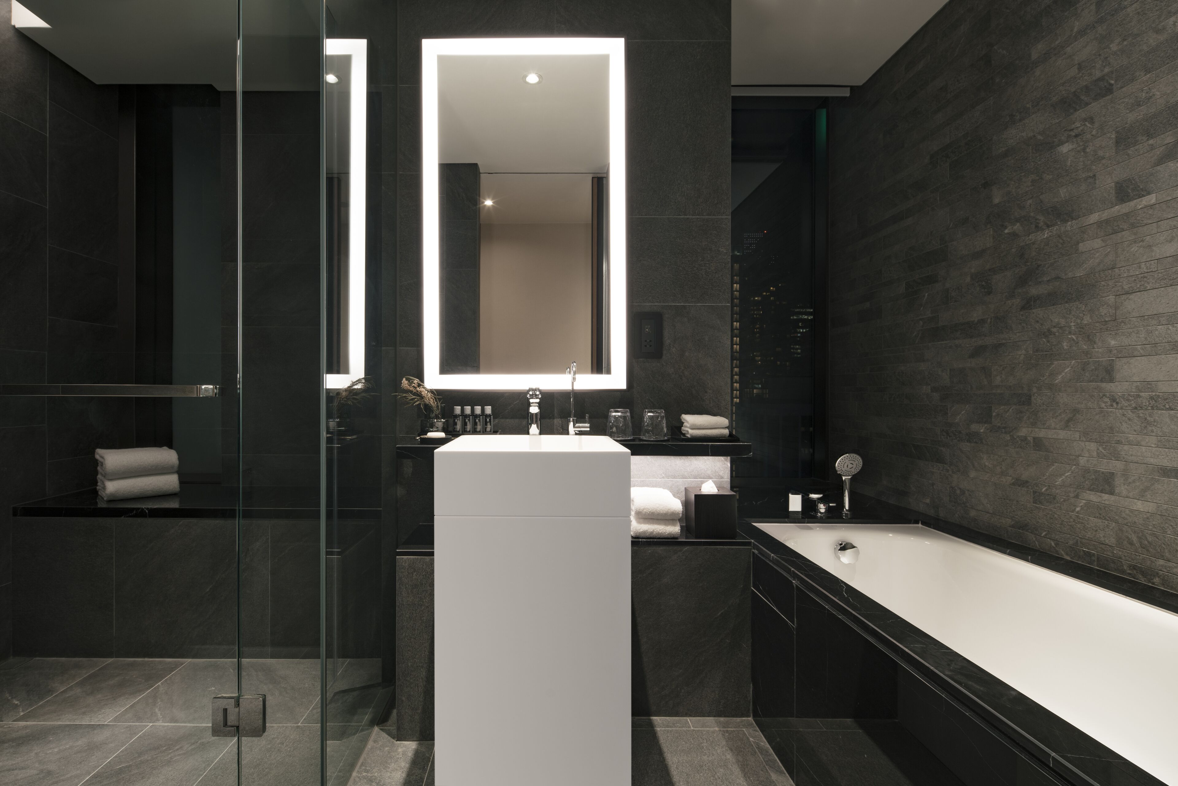 designer toiletries, hair dryer, bathrobes, slippers