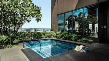 Outdoor pool, open 6:00 AM to midnight, pool loungers