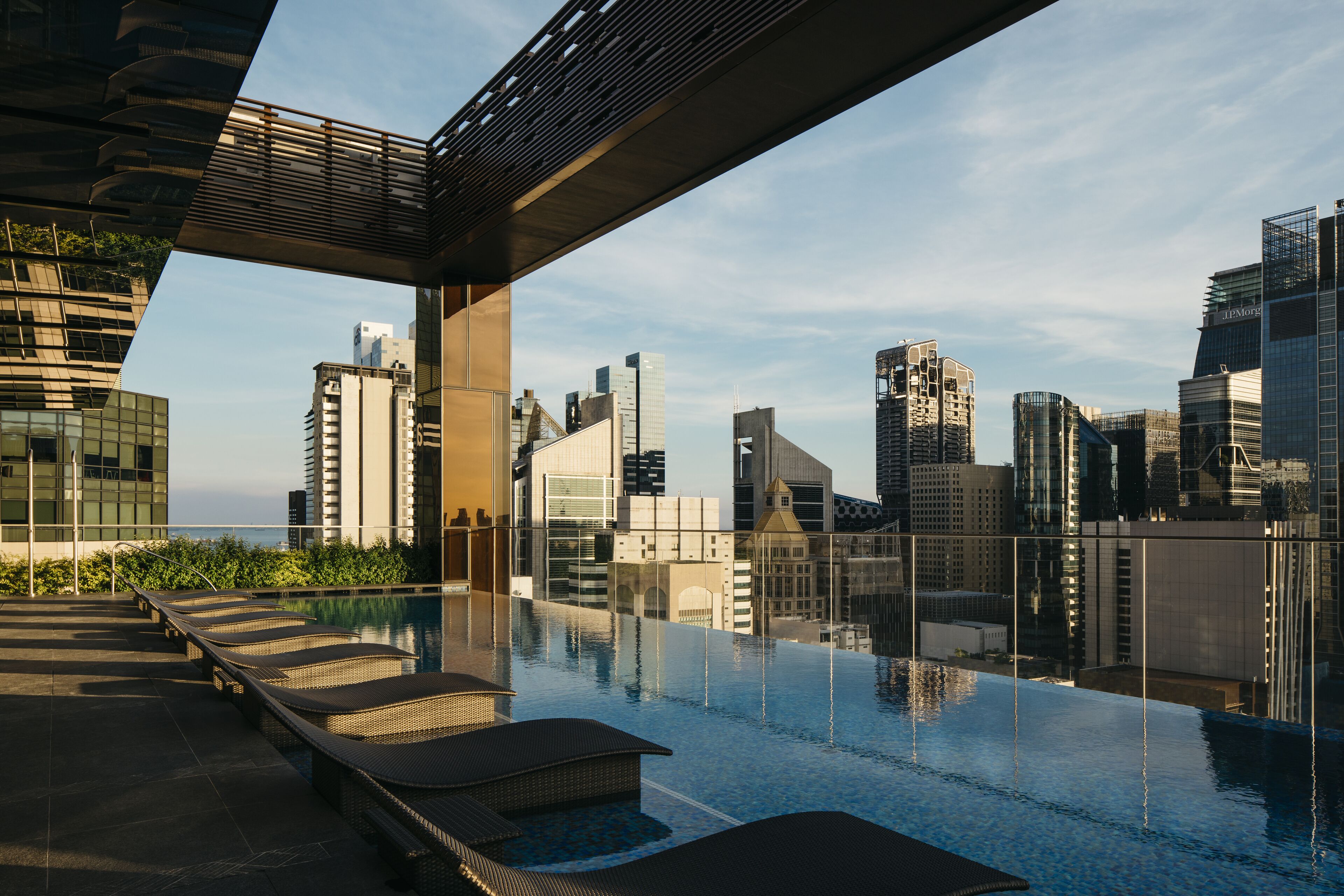 Outdoor pool, open 6:00 AM to midnight, pool loungers