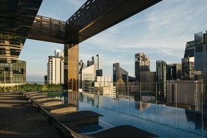 Outdoor pool, open 6:00 AM to midnight, pool loungers