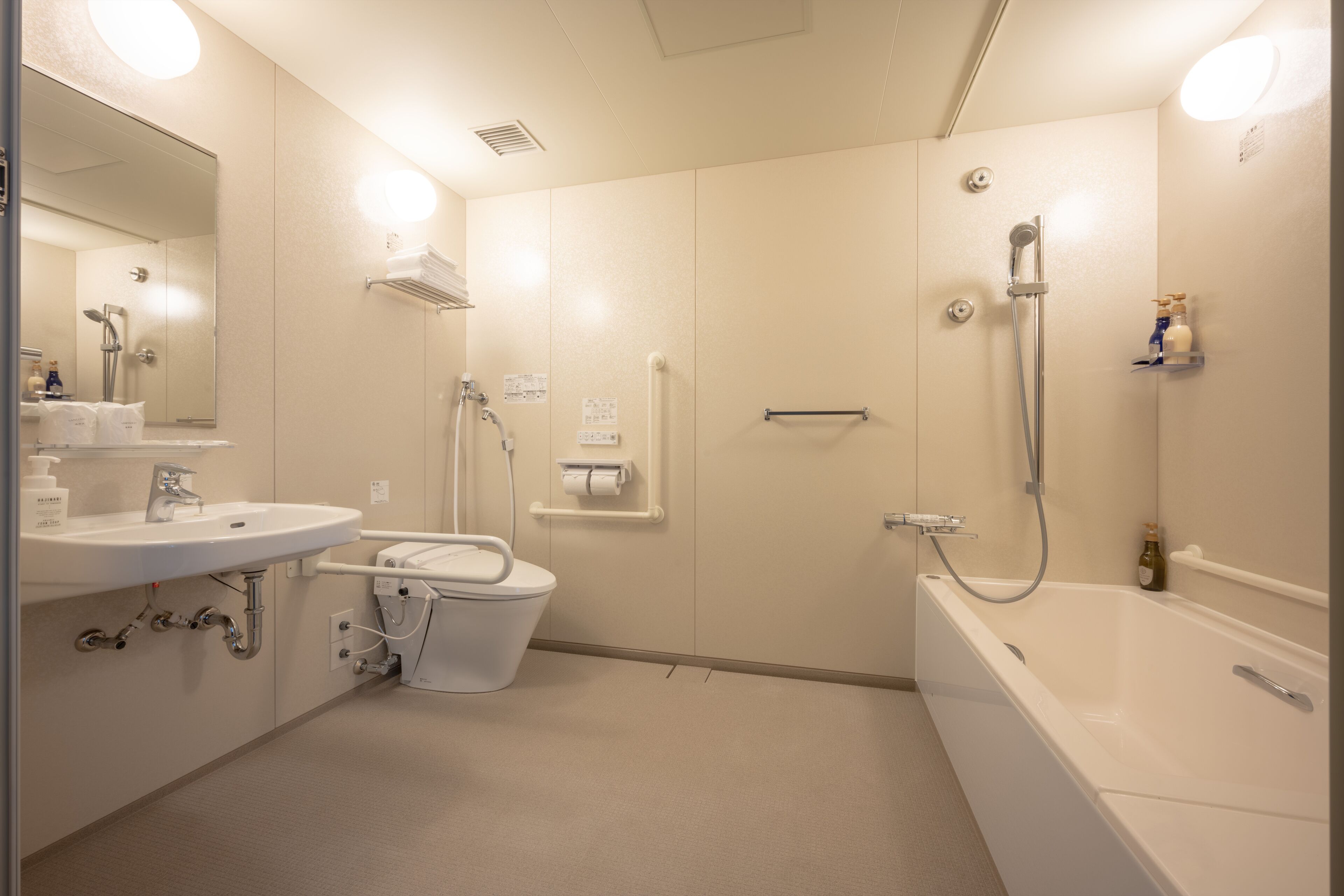 accessible twin room | bathroom | free toiletries, hair dryer, slippers, bidet