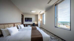 A hotel room with a large bed, a desk, a chair, a TV, and a window with a city view. - Hotel Maruya Grande (Minamisoma)