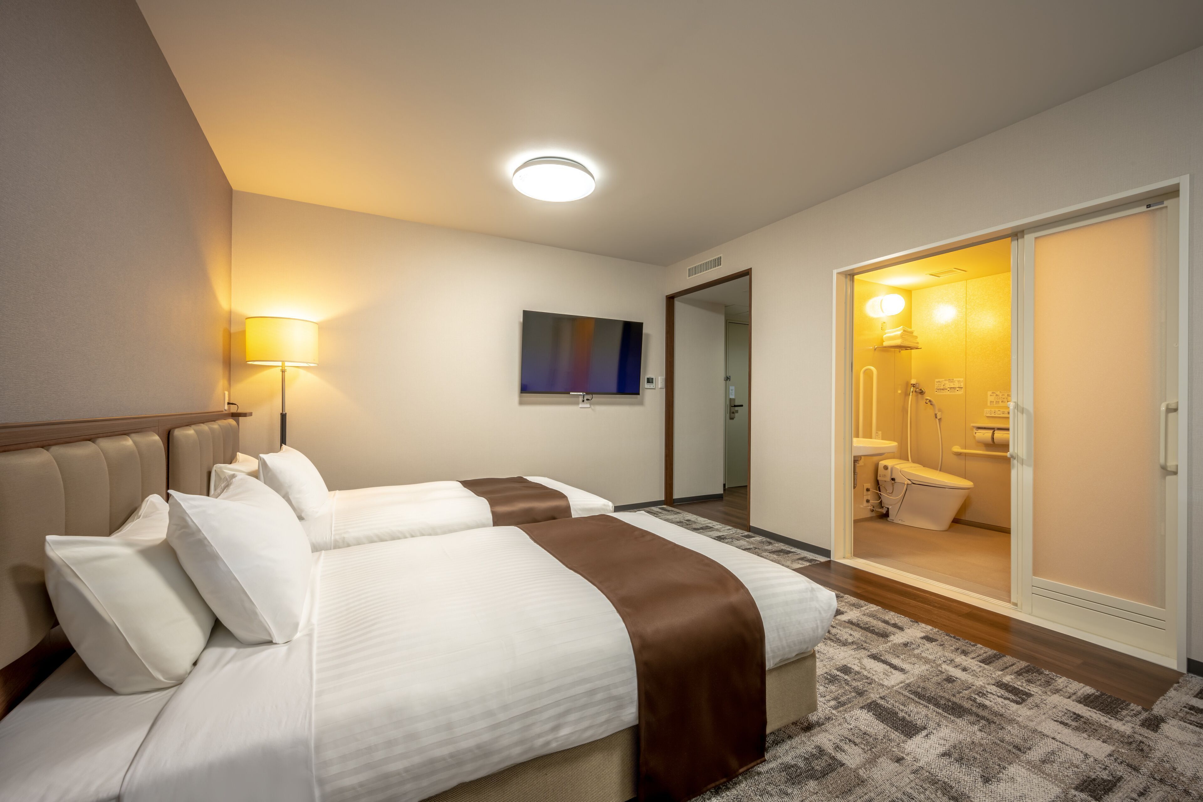 Premium bedding, desk, laptop workspace, soundproofing