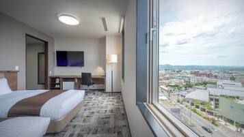 Premium bedding, desk, laptop workspace, soundproofing