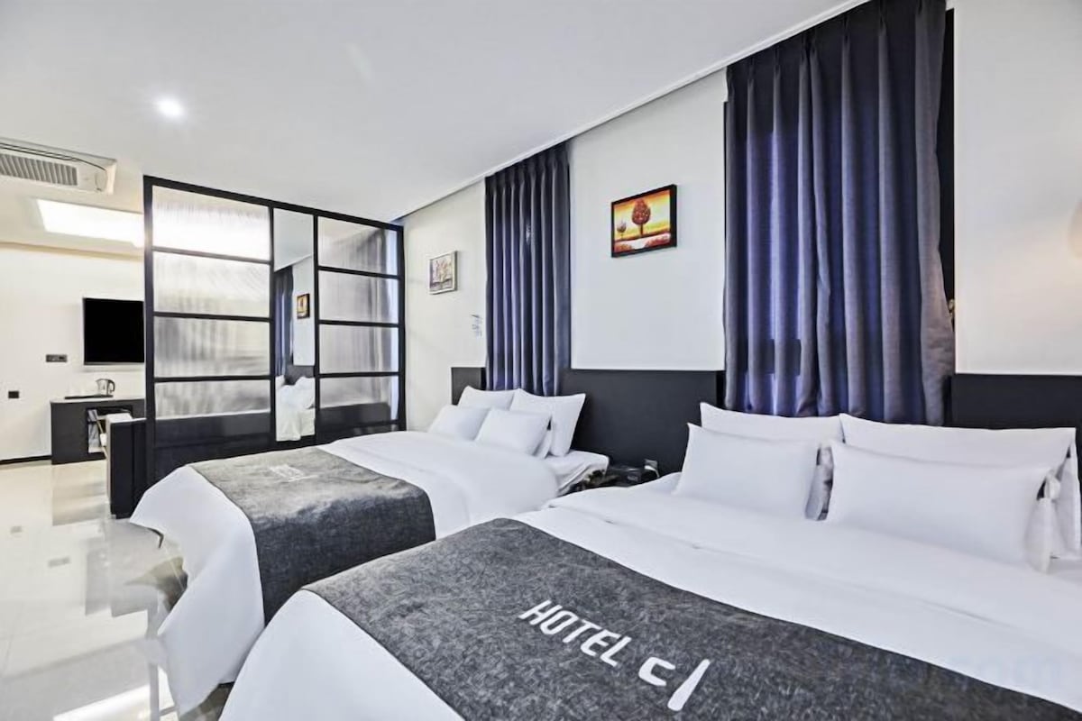 Premium bedding, down comforters, memory foam beds, laptop workspace