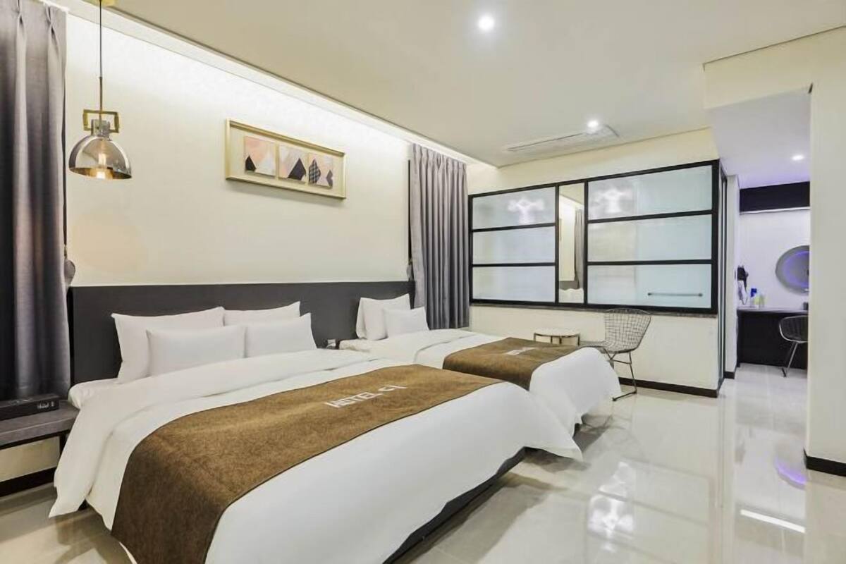 Premium bedding, down comforters, memory foam beds, laptop workspace