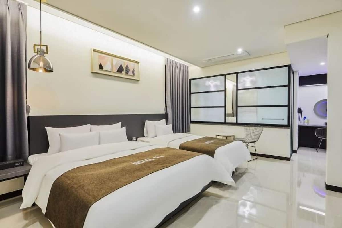 Premium bedding, down comforters, memory foam beds, laptop workspace
