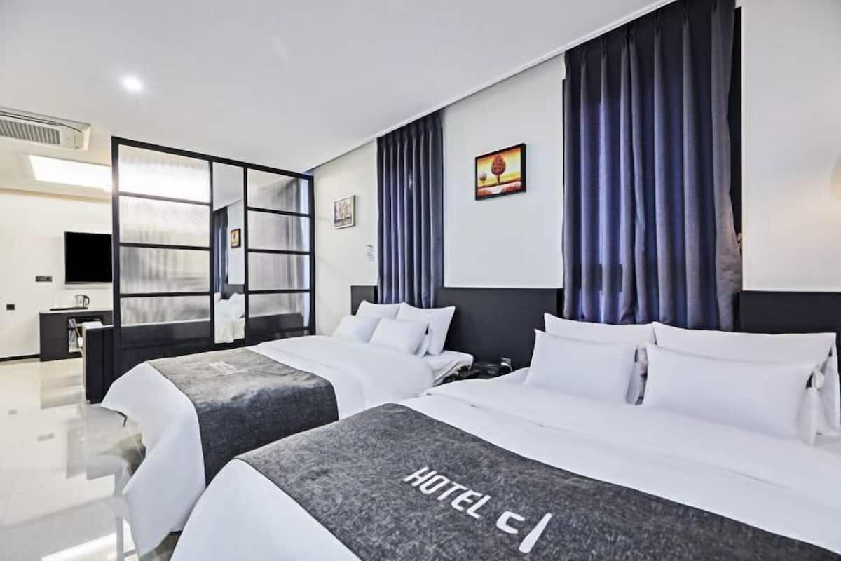 Premium bedding, down duvets, memory-foam beds, laptop workspace