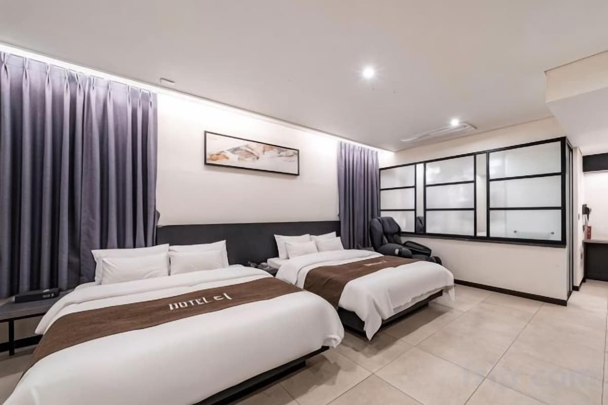 Premium bedding, down comforters, memory foam beds, laptop workspace