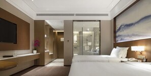 Down comforters, pillowtop beds, in-room safe, desk