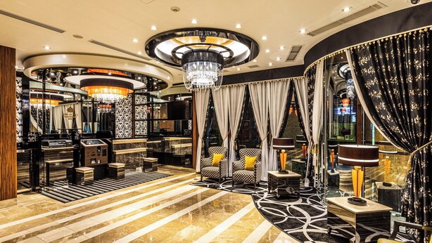 A luxurious lobby with a marble floor, a grand chandelier, and a seating area with patterned chairs. - APA Hotel Nambaminami Ebisucho Eki Shinsekai (Osaka)