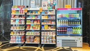 A vending machine stocked with beverages and a refrigerated display of snacks and drinks. - APA Hotel Nambaminami Ebisucho Eki Shinsekai (Osaka)
