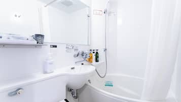 Combined shower/tub, free toiletries, hair dryer, slippers