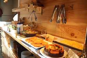 Indulge in a variety of dishes, including fried and baked options, at our buffet.